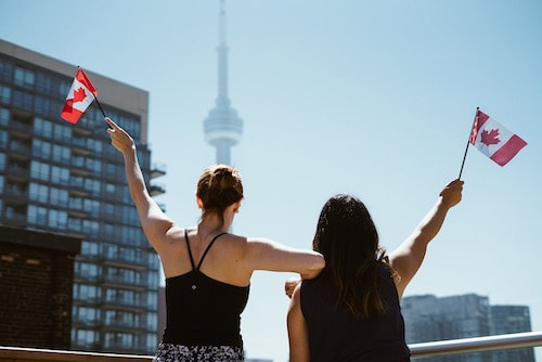 People Waving Canadian Flag